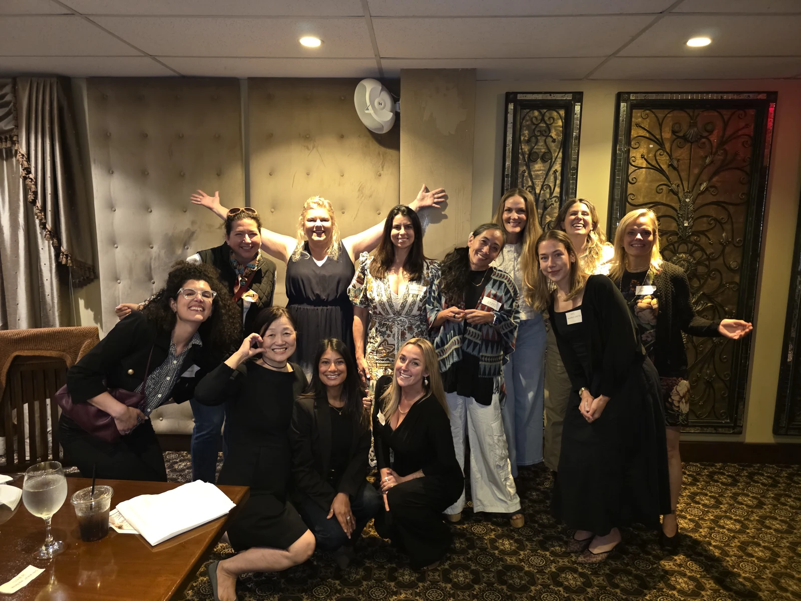 Women together at a FoundHER and FundHER dinner