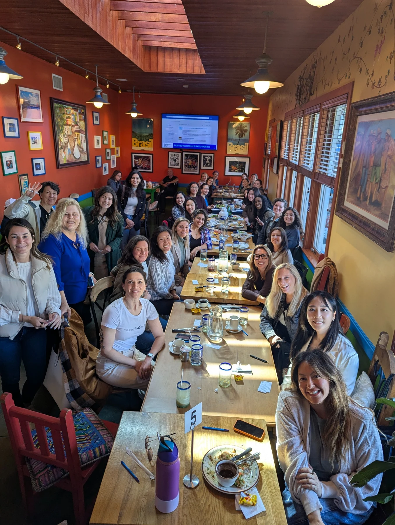 Women gathered at the approved long-table community lunch